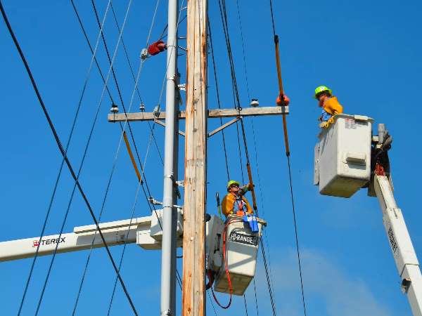 A crew works to resolve a power outage