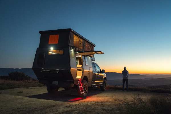 Man overlanding with an RV with pop-up camp