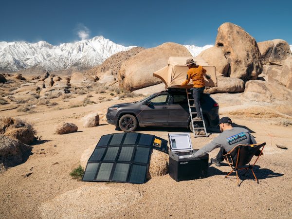 Two men camping with BougeRV Paso 100W portable solar panel and BougeRV 12V refrigerator