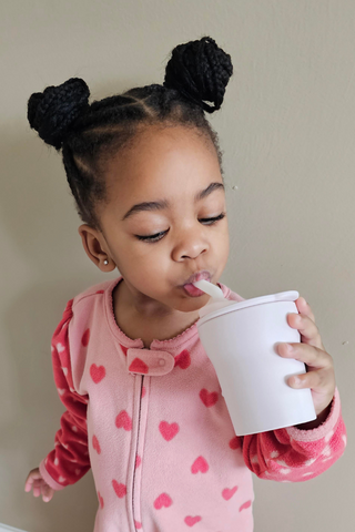 Toddler using Miniware sippy cup 1-2-3 Sip in Cotton Candy