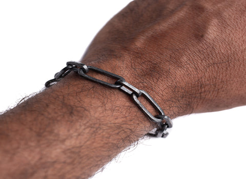 a black chain link bracelet with a style of rectangular links