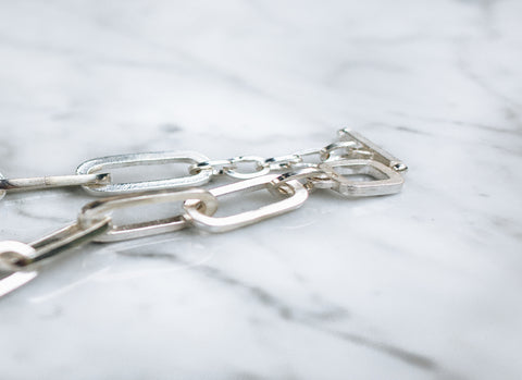 a jewelry chain link necklace made with solid silver