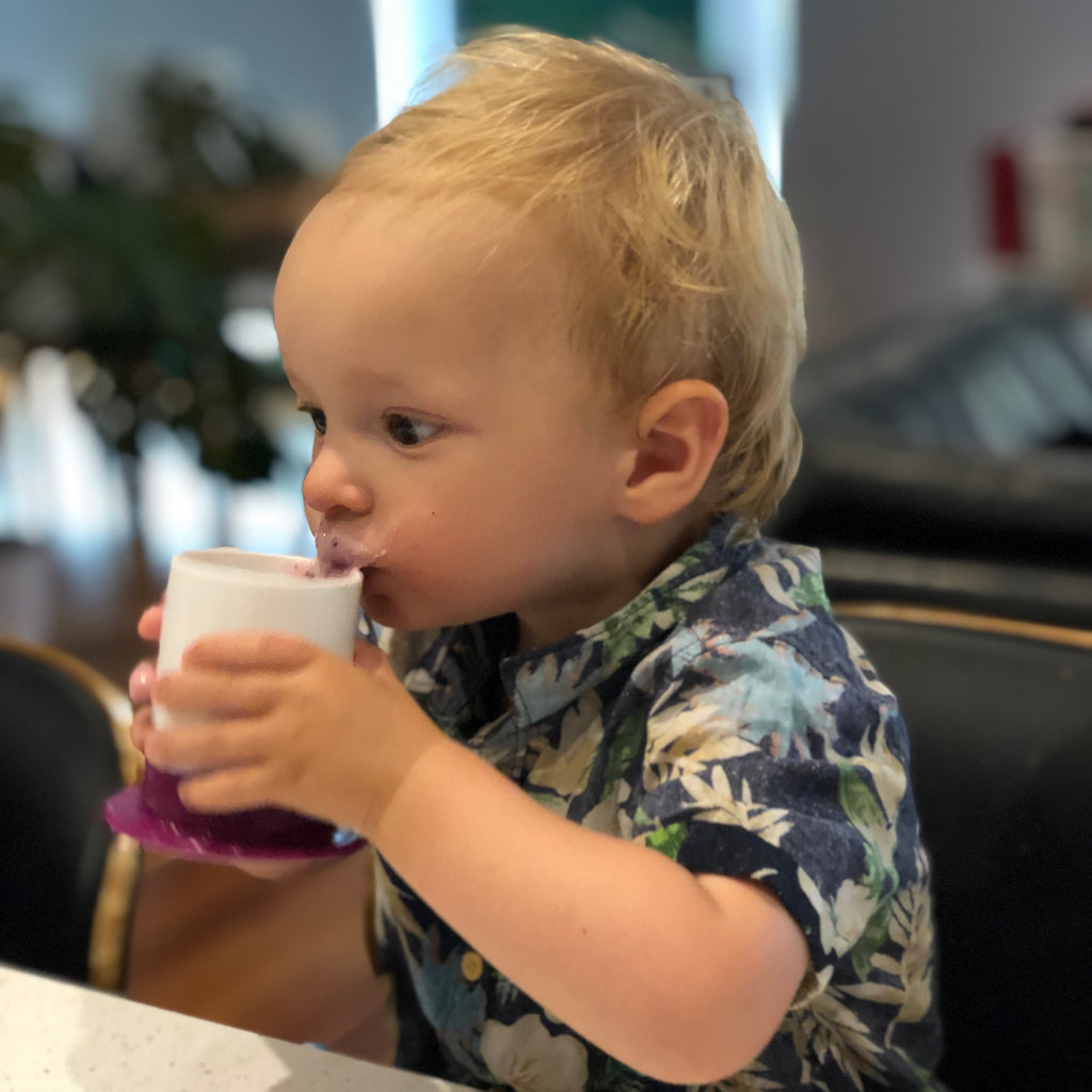 Toddler drinking Banana smoothie