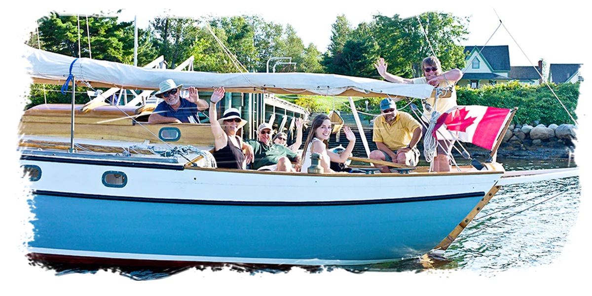 People waving in sailboat