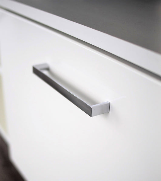Chrome metal handle on high gloss cabinet finish