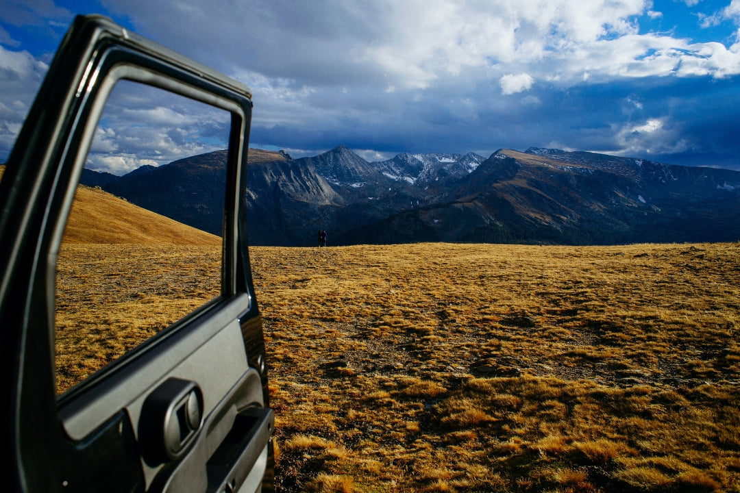 car door open to mountainscape