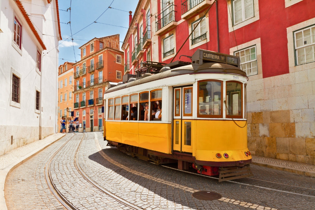 lisbon yellow streetcar colorful buildings