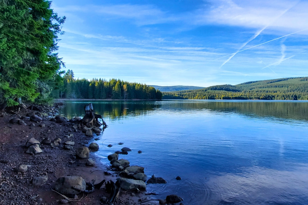 portland camping reflective lake and evergreens