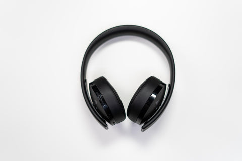 travel accessories black headphones white background