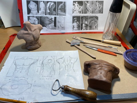 modeling a make torso in clay