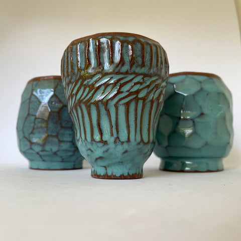 3 Kurinuki carved cups with carved facetted textures in glossy turquoise glazes