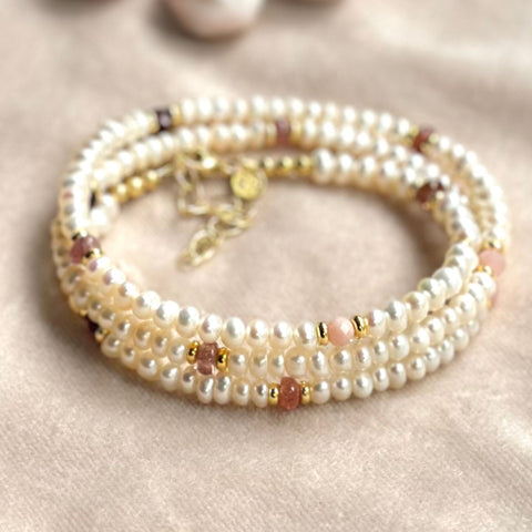 Freshwater pearl wrap set with pink opal, spinel and garnet gemstones as well as gold beads