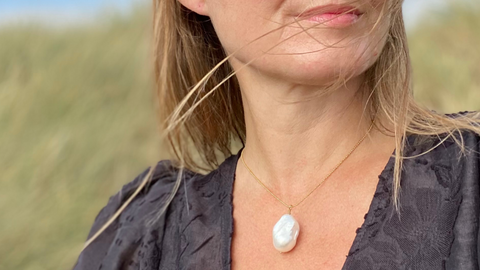 RAW Copenhagen nominated as best jewellery store in kent in the Muddy Stilettos Awards in 2021 in the image is shown the RAW Copenhagen freshwater pearl necklace with a gorgeous big white baroque pearl