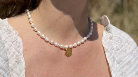 The RAW Copenhagen Aphrodite Pearl Necklace, a classic string of pearls with a twist