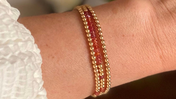 Padparadscha sapphires set against 14K gold filled beads in a wrap