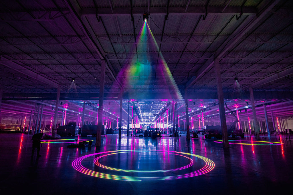 20 Watt Spectrum Laser mounted from ceiling, projecting colorful laser beams on ground.