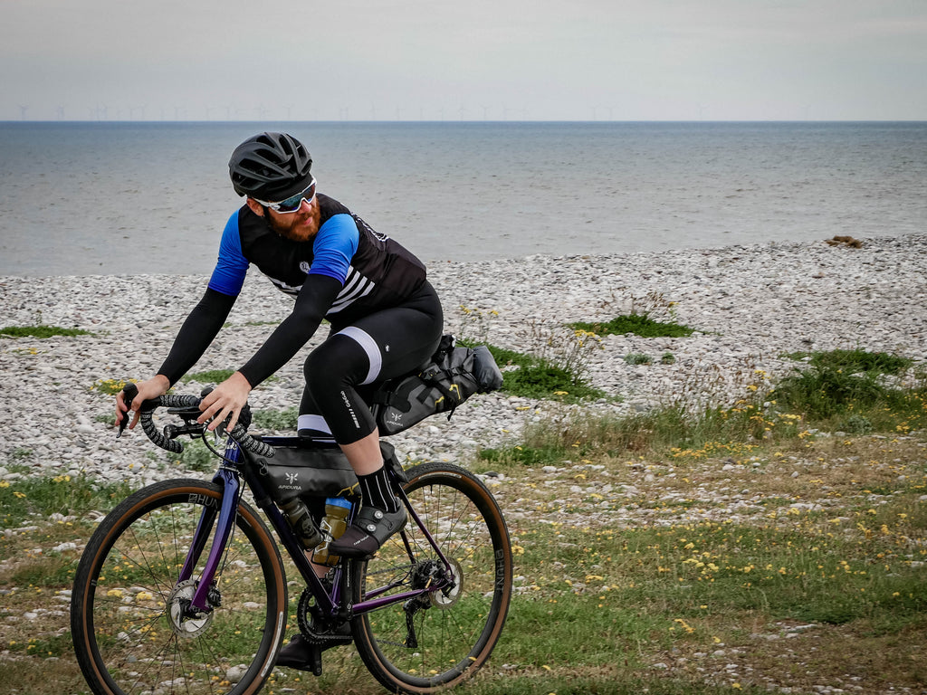 Endurance cyclist Chris Hall talks Silk Road Mountain Race 2018 wearing Sweet Spot blue dissolve cycling Jersey dark dagger gilet and black bib shorts