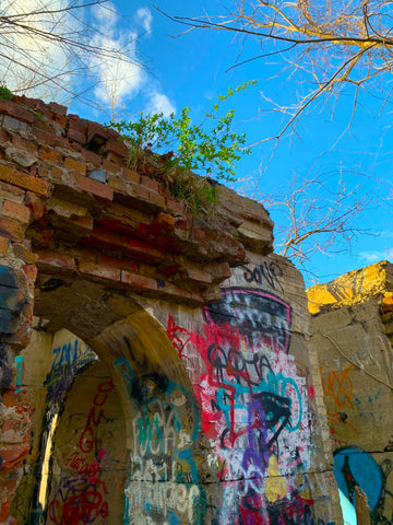 Graffitied ruins and blue sky at Belcher Cove, Rhode Island, along the East Bay Bike Path.