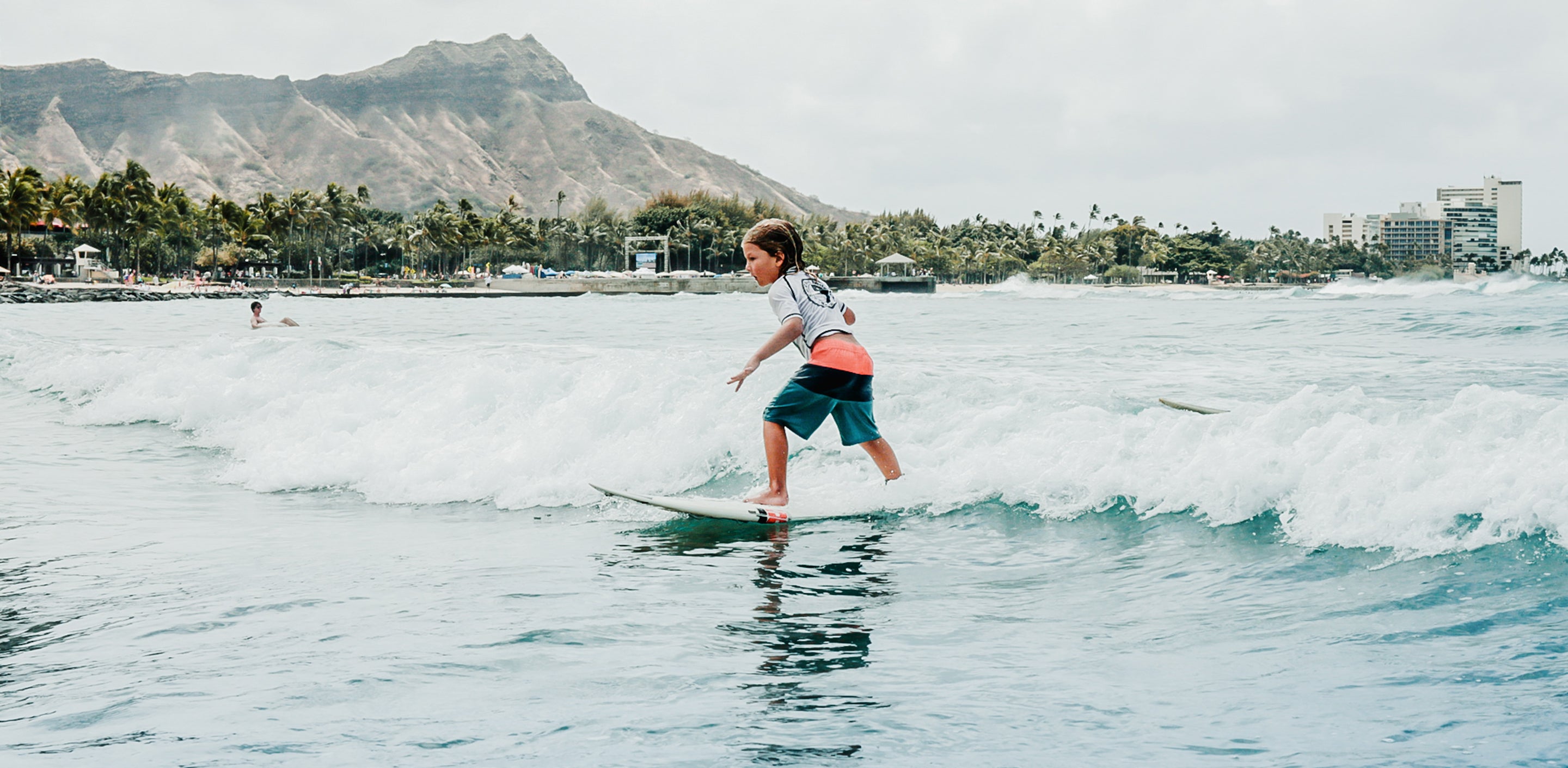 T&C Grom Contest Kokua division showcasing youth competitor