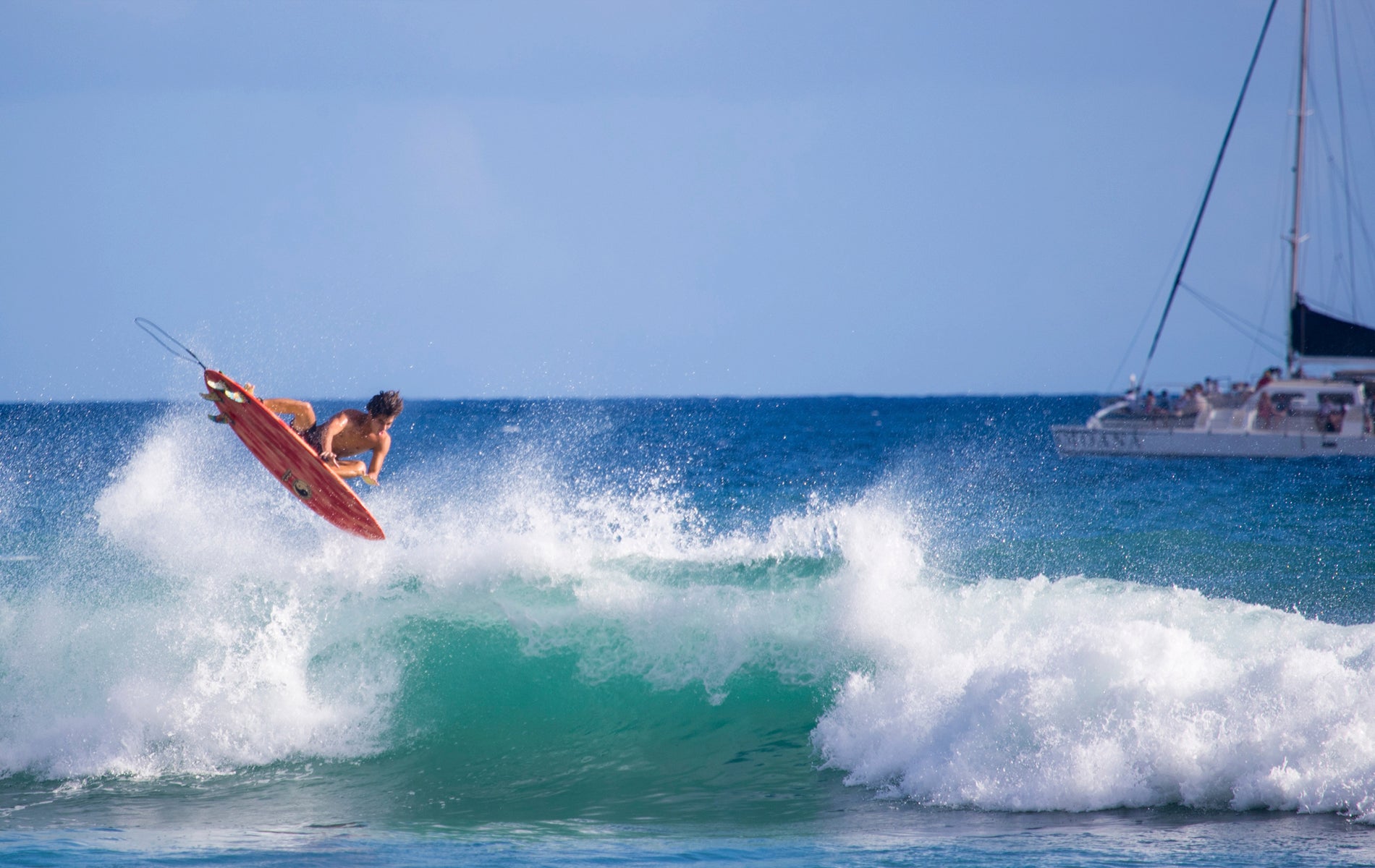 Hawaii surfer, Noah Kawaguchi navigating an aerial maneuver
