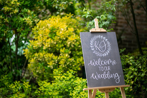 Grey wedding welcome sign on easel