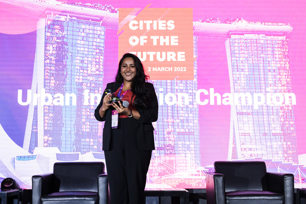 Ishwarya Rama the junior co-founder of The Nurturing Co accepting the Urban Innovation Champions award at Cities of the Future 2022