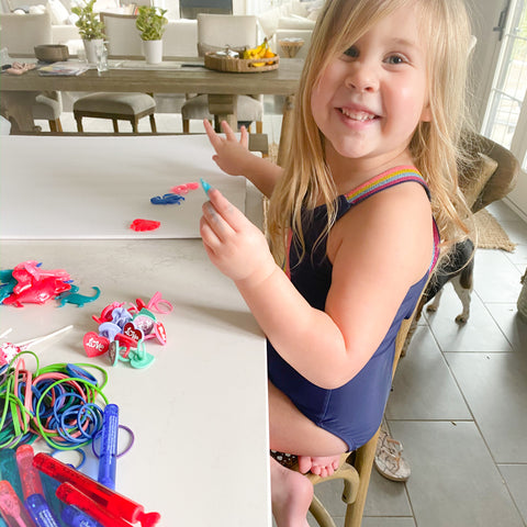 Child filling cups for game