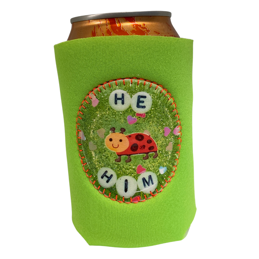 https://cdn.shopify.com/s/files/1/2688/8674/products/drink-holder-he-him-front_1600x.png?v=1671061029