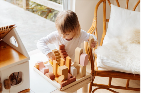 Child playing with Construction Toys