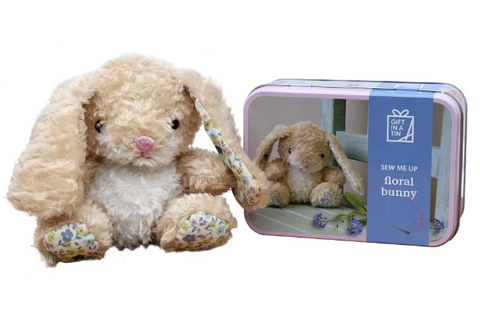 Cuddly cream coloured bunny toy with floral patterned feet and ears