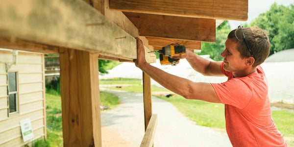 Farm Hand working on Pack Shed