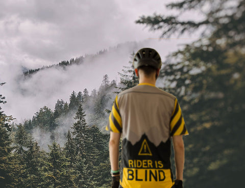serge out in the wilderness prepared to go for a mountain biking session with his Rider is Blind Custom Champion System Cycling Jersey