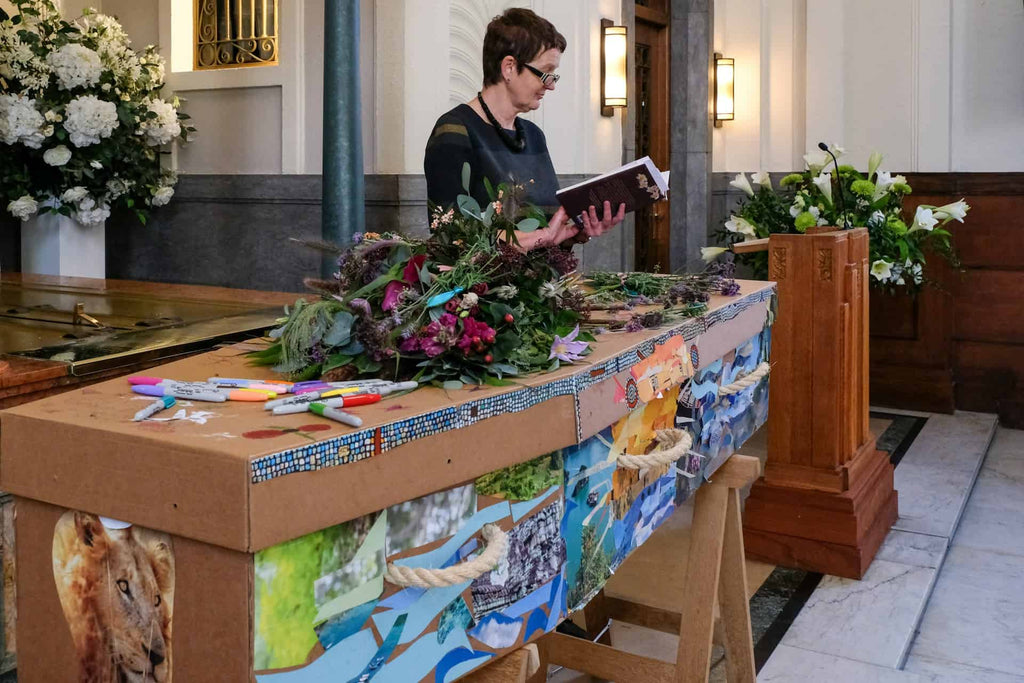 Woman giving a eulogy at a funeral