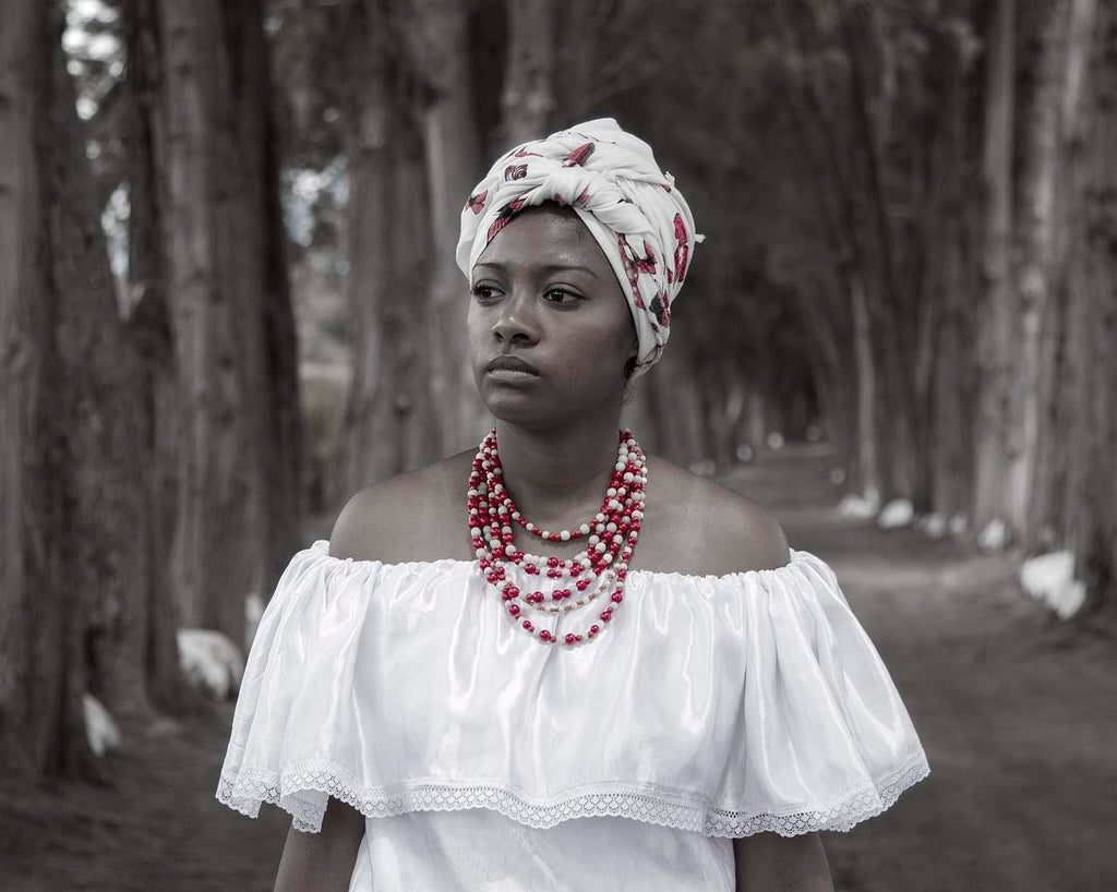 African mourner wearing white funeral clothes