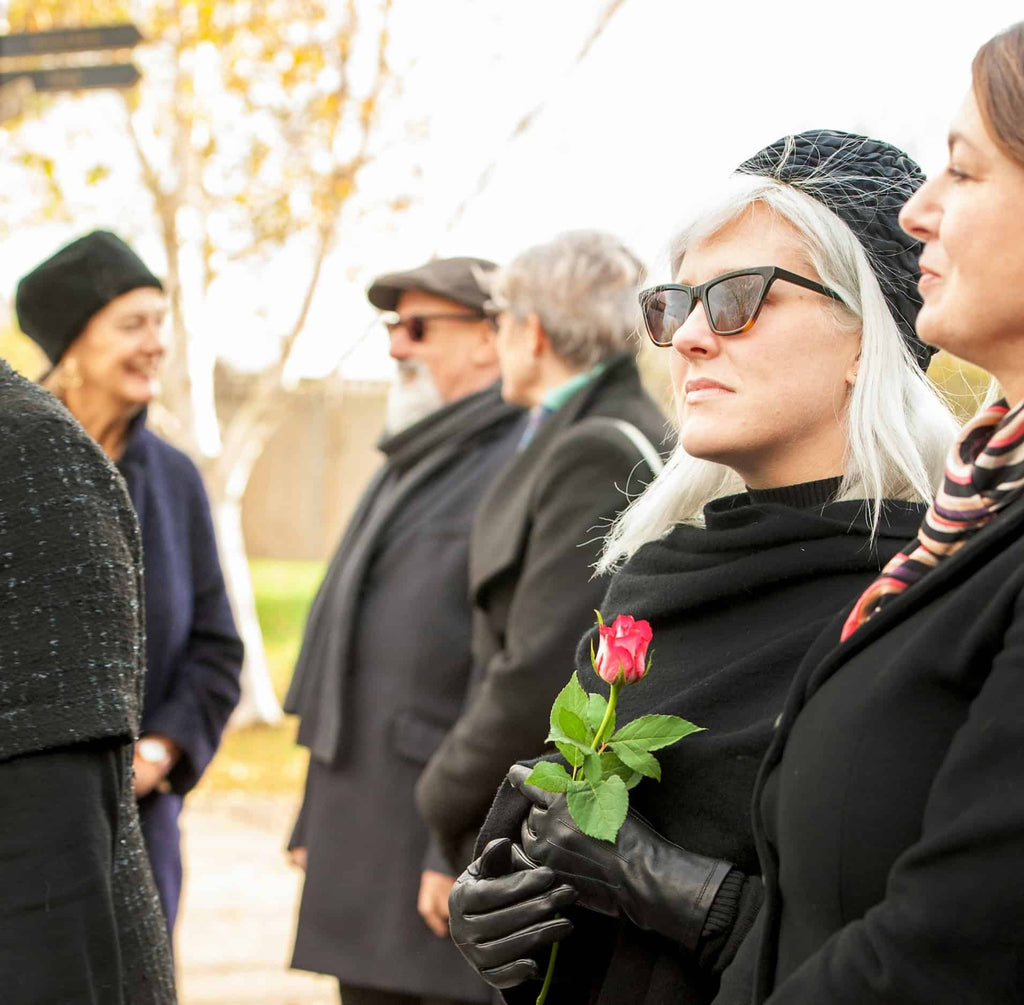 Mourners wearing black at a funeral