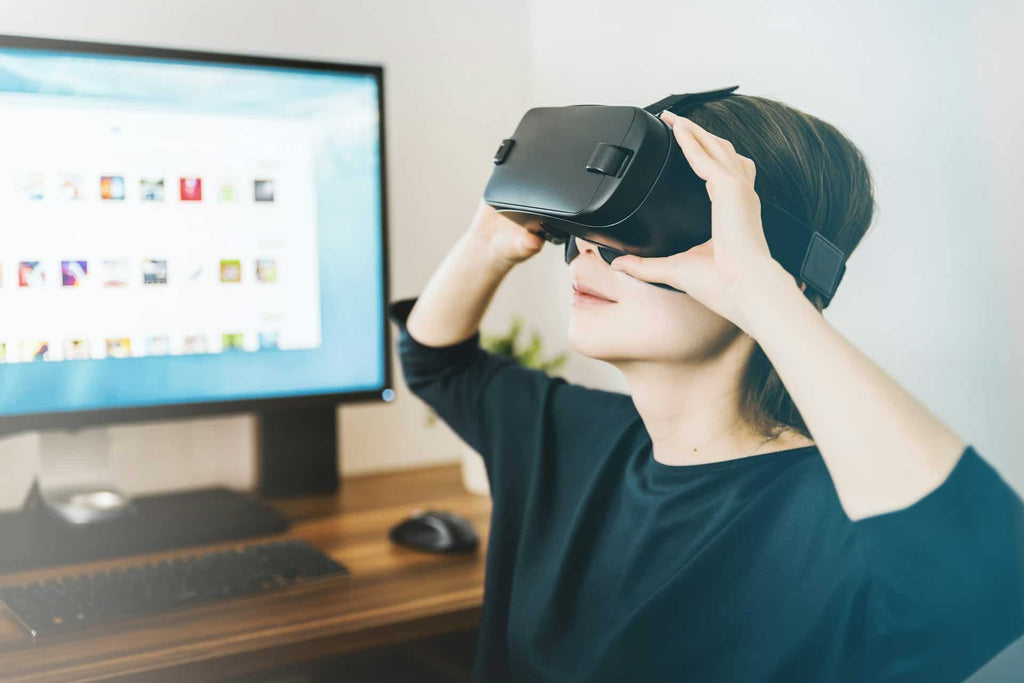 Woman planning a funeral and testing a virtual reality headset