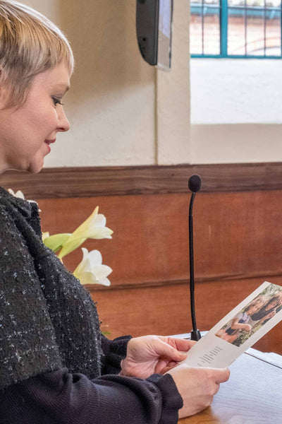 Woman reading a personalized eulogy