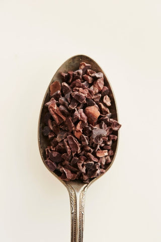 Ground cacao in a spoon 