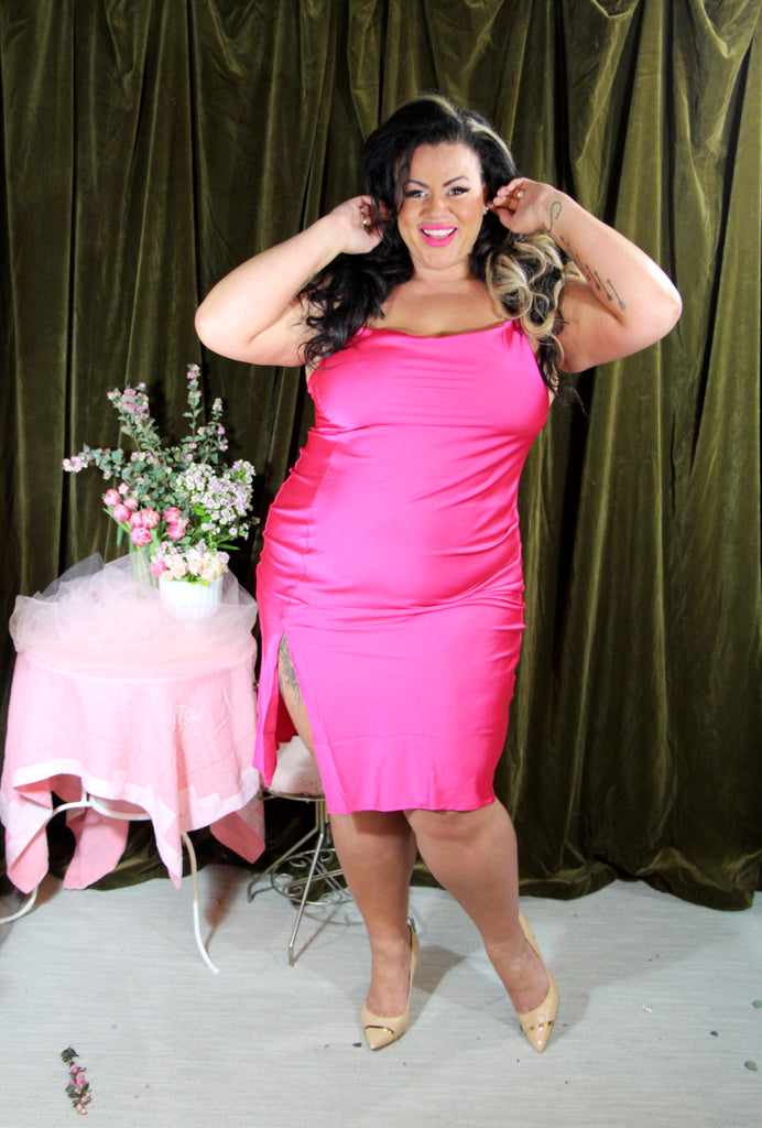 Ivory poses in pink satin Kilo Brava midi slip dress, it is a bright shocking pink!