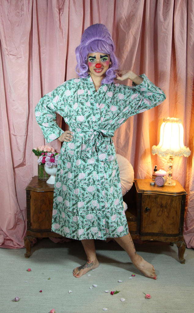 Imogen in glamour clown makeup wears a cotton robe by Dilli Grey