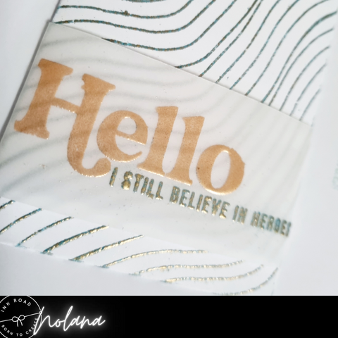 embossed vellum words on pocket with embossed wave background