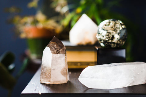 Table with money crystals including Pyrite and Clear Quartz