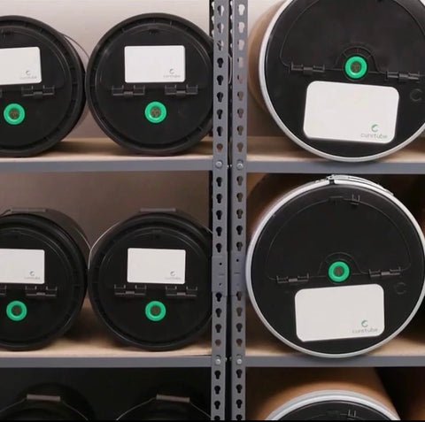 CureTubes and Quick Cure Bucket Lids displayed on a racking system