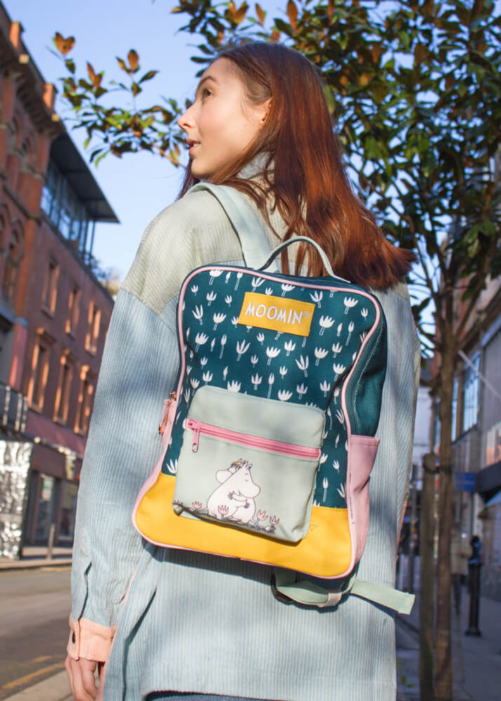 girl wearing Moomin backpack