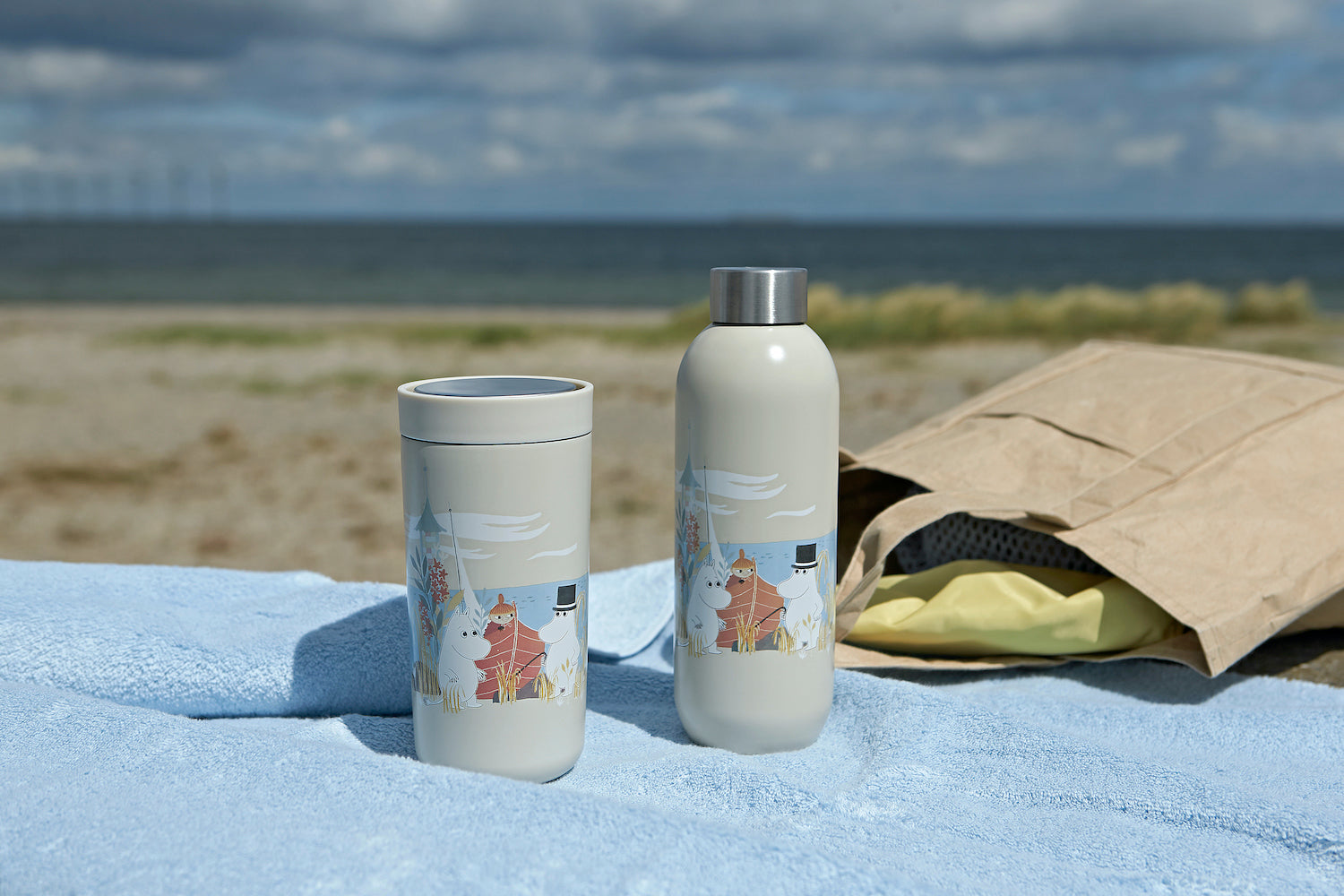thermal Moomin takeaway bottle and cup on blanket on beach
