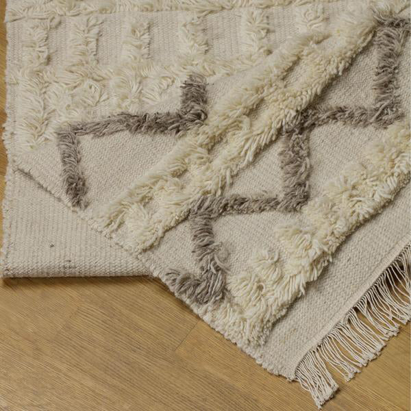 Product photograph of Andrew Martin Lusaka Taupe Rug Cream 305 X 4 X 244cm from Olivia's.