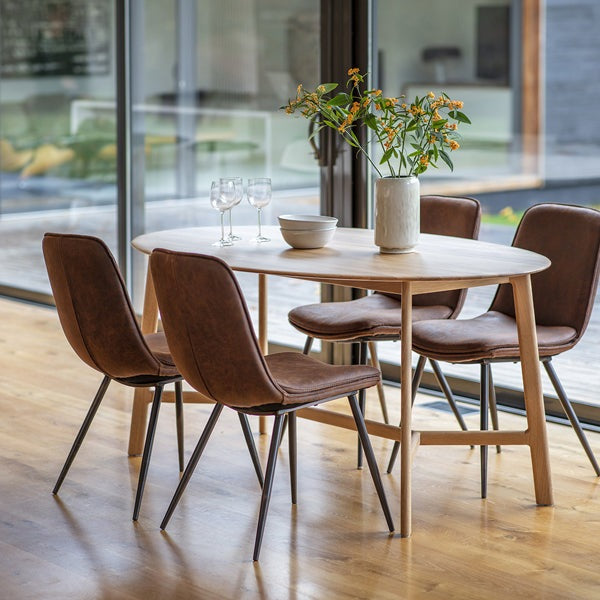 Product photograph of Gallery Interiors Madrid Oval 6 Seater Dining Table from Olivia's.