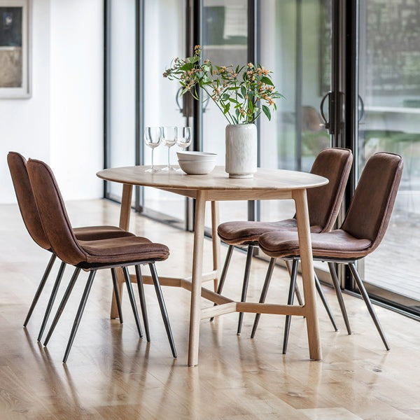 Product photograph of Gallery Interiors Madrid Oval 6 Seater Dining Table from Olivia's.