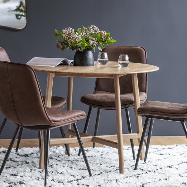 Product photograph of Gallery Interiors Madrid Brown Round 4 Seater Dining Table from Olivia's.