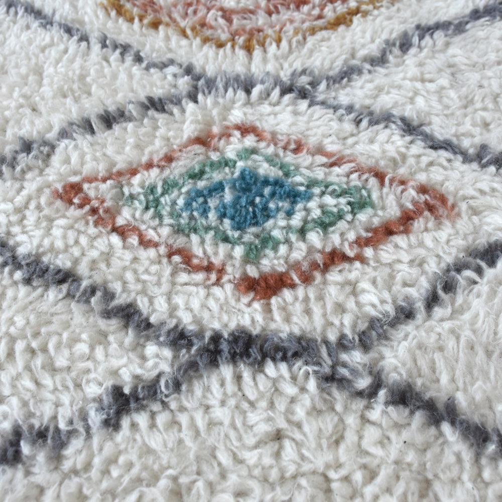 Product photograph of Libra Calm Neutral Collection - Anrath Table Tufted Ivory Multi Colour Pattern Wool Rug from Olivia's.